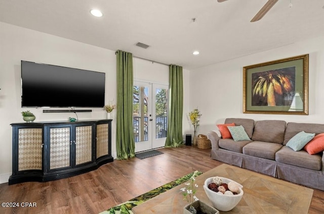 living room with hardwood / wood-style flooring and french doors