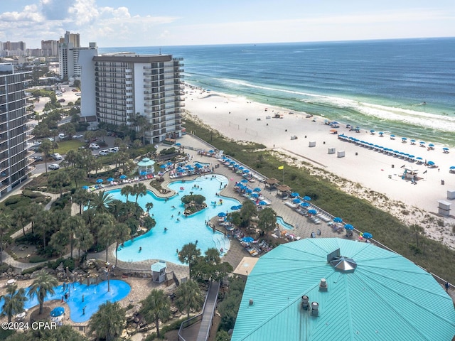 drone / aerial view with a water view and a beach view