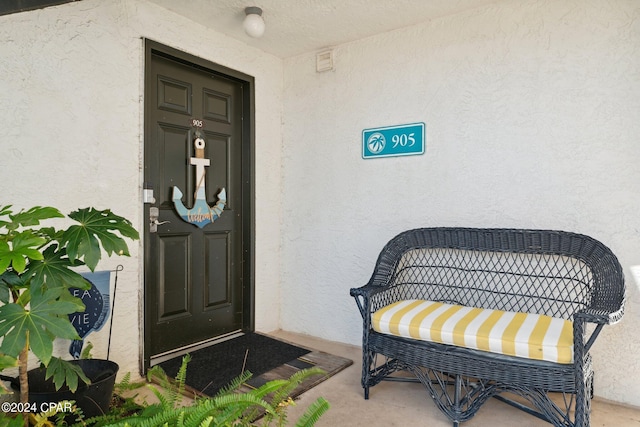 entrance to property featuring a porch