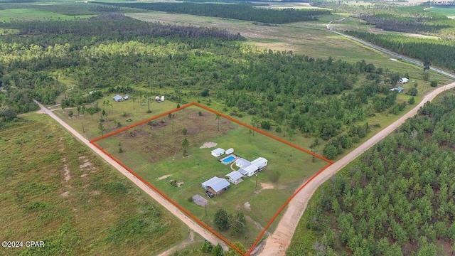 birds eye view of property featuring a rural view