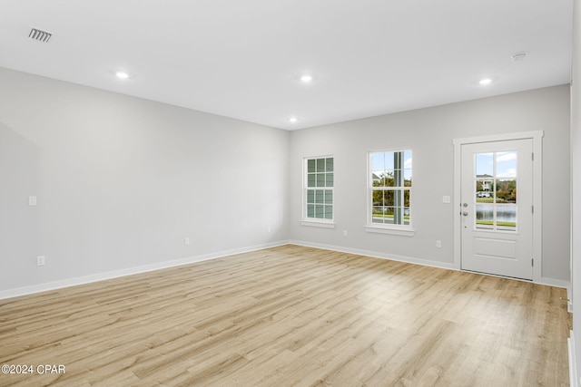 unfurnished room featuring light hardwood / wood-style floors