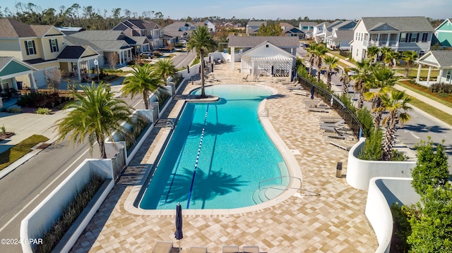 view of swimming pool featuring a patio area