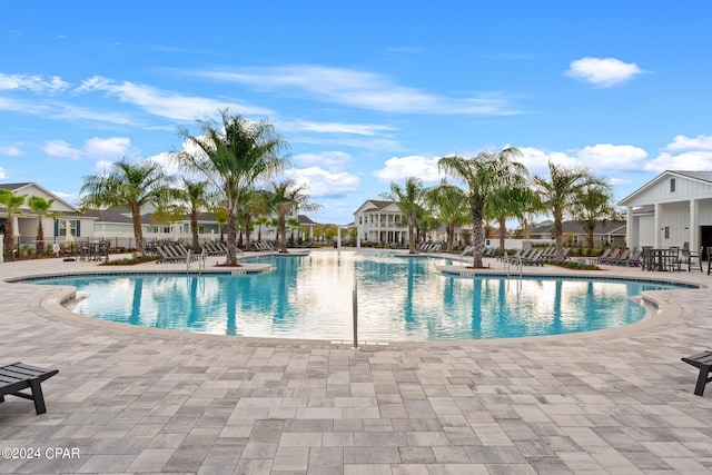 view of swimming pool with a patio area