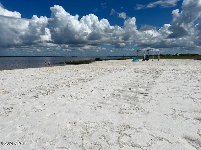 view of water feature with a beach view