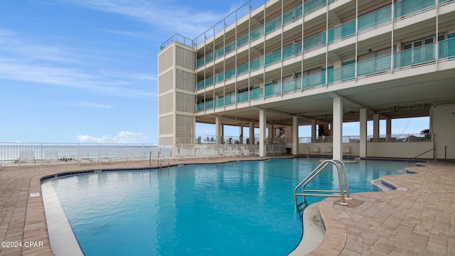 view of pool featuring a patio