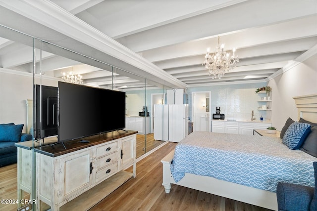 bedroom with an inviting chandelier, light wood-type flooring, and beam ceiling