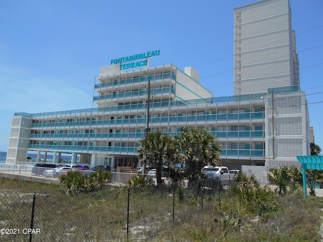 14401 Front Beach Rd Unit 433, Panama City Beach, FL 32413 - view of building exterior with uncovered parking