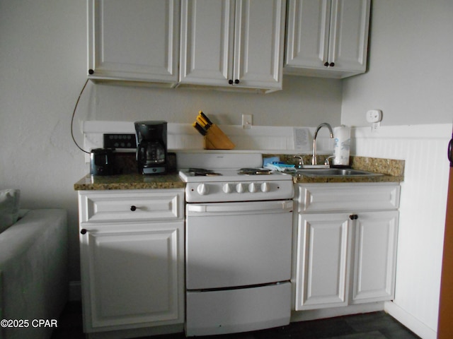 14401 Front Beach Rd Unit 433, Panama City Beach, FL 32413 - kitchen featuring white range with electric stovetop and white cabinets
