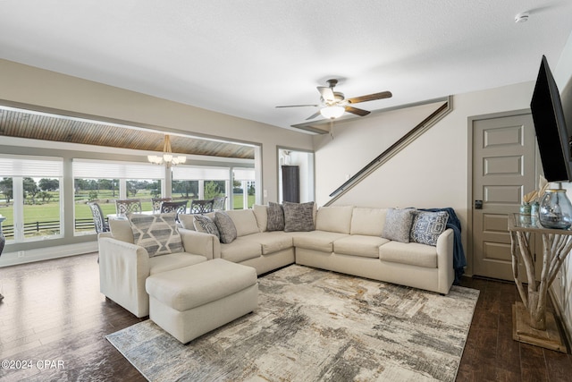 living room featuring a textured ceiling, ceiling fan with notable chandelier, lofted ceiling with beams, and wood-type flooring