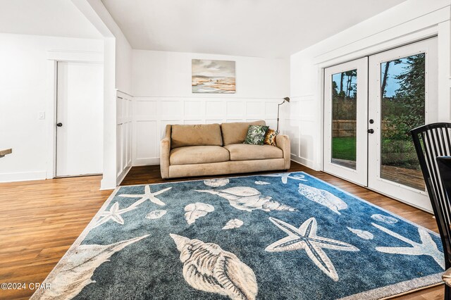 living room with french doors and wood-type flooring