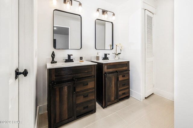 bathroom with tile patterned flooring and vanity