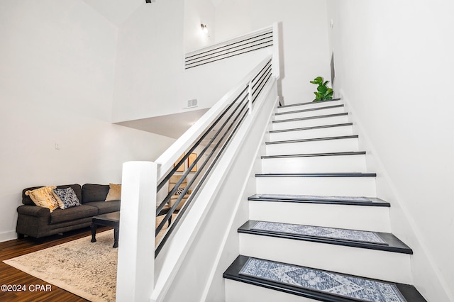 stairway with wood-type flooring