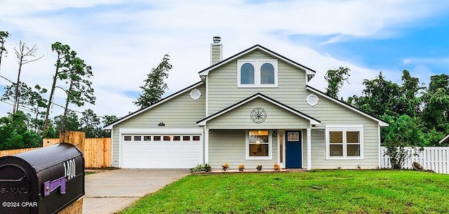 view of front of home with a garage and a front lawn