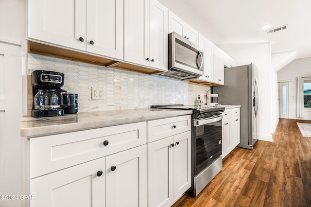 kitchen featuring light stone counters, stainless steel appliances, backsplash, dark hardwood / wood-style flooring, and white cabinets