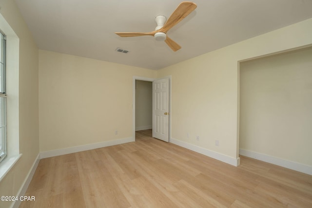 spare room featuring ceiling fan and light hardwood / wood-style flooring