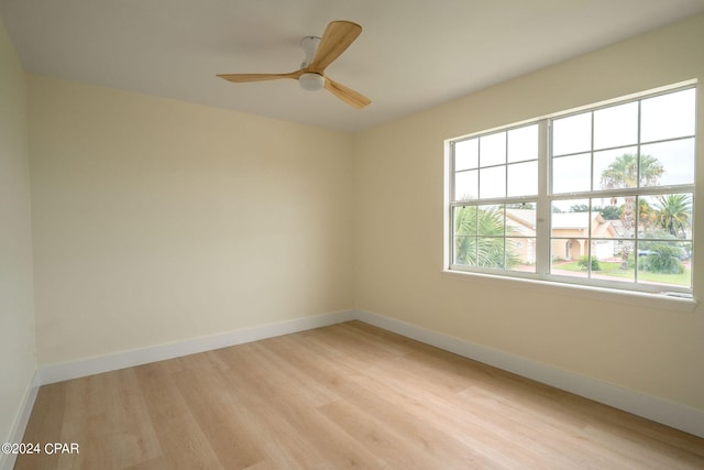 spare room with ceiling fan and light hardwood / wood-style flooring