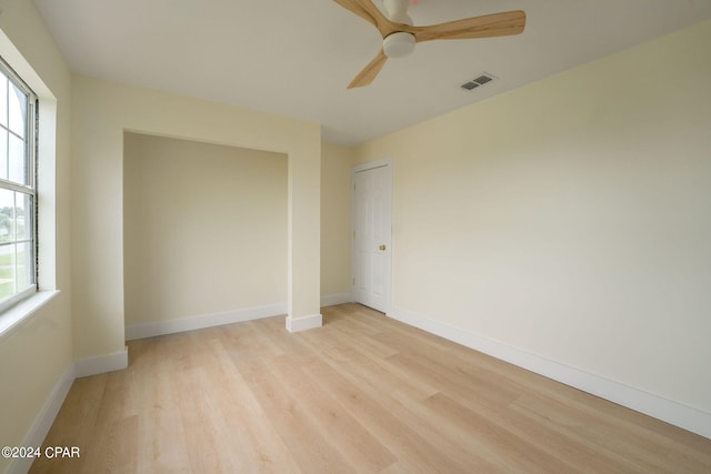 unfurnished bedroom with light wood-type flooring and ceiling fan