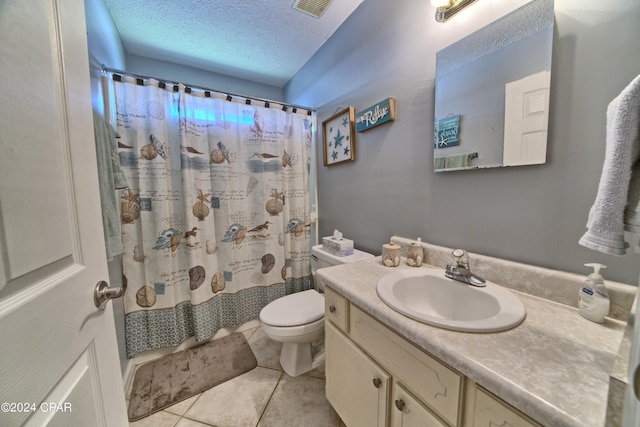 bathroom featuring a textured ceiling, toilet, vanity, a shower with curtain, and tile patterned flooring