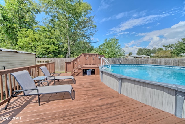 view of pool with a deck