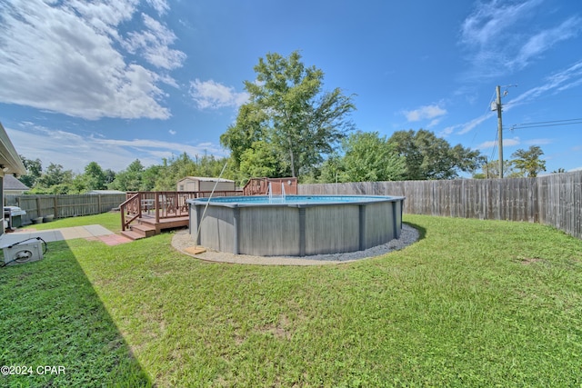 view of yard featuring a swimming pool side deck