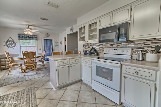 kitchen with white cabinetry, electric stove, decorative backsplash, and kitchen peninsula