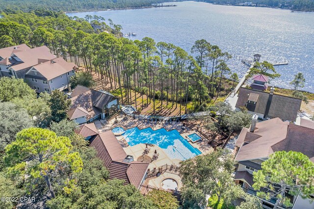 birds eye view of property with a water view