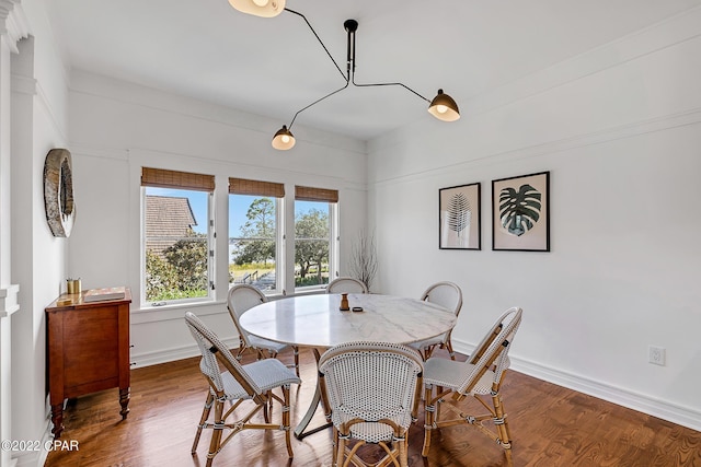 dining area with wood-type flooring