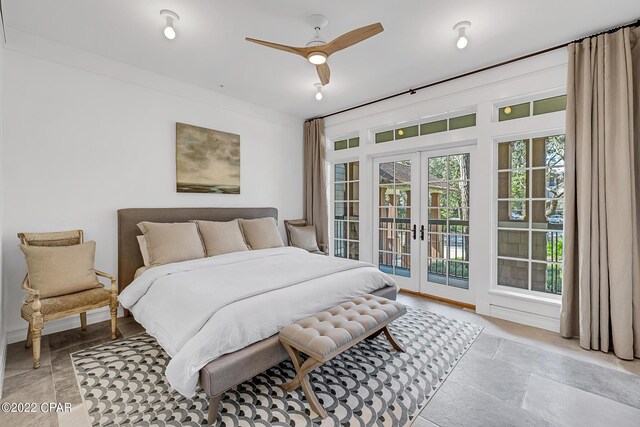 bedroom with access to exterior, ceiling fan, and french doors