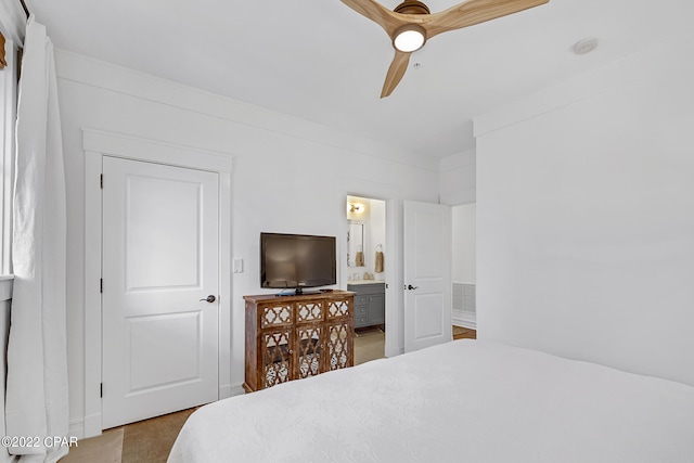 bedroom with ensuite bath and ceiling fan