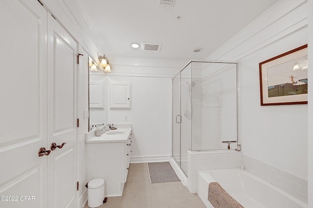 bathroom featuring tile patterned flooring, vanity, and shower with separate bathtub