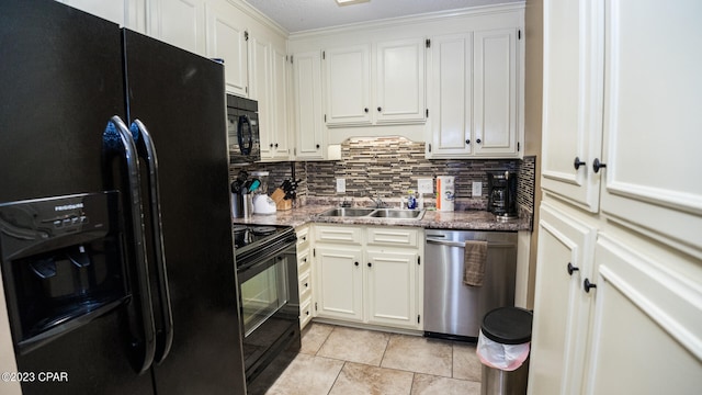 kitchen with light stone countertops, black appliances, ornamental molding, white cabinetry, and light tile patterned flooring