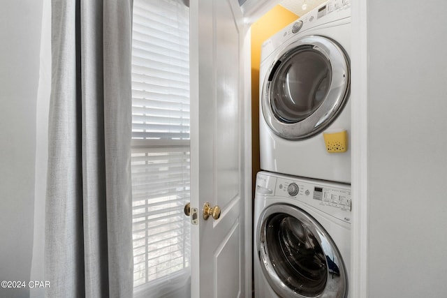 laundry room featuring stacked washing maching and dryer