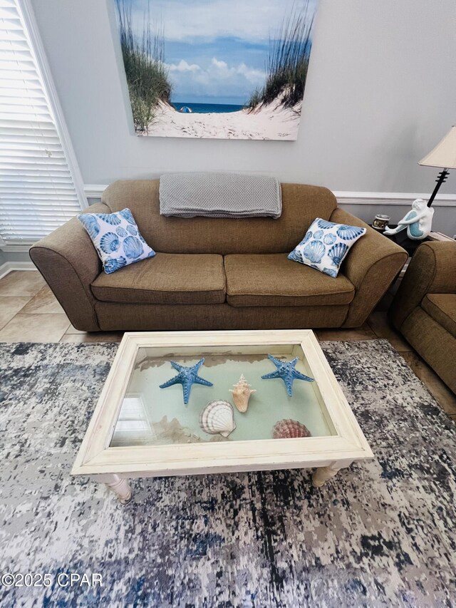 living room with tile patterned flooring