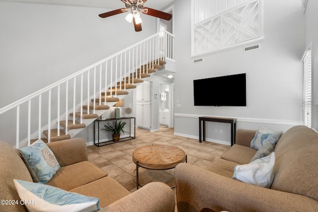 living room featuring high vaulted ceiling and ceiling fan