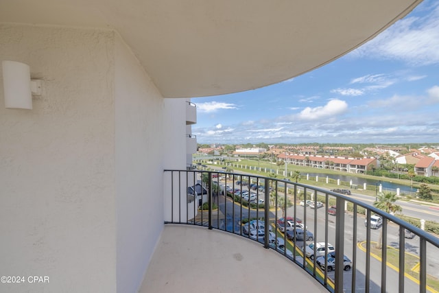 balcony featuring a water view