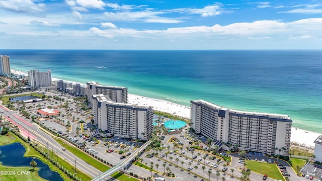 bird's eye view with a water view, a view of city, and a beach view