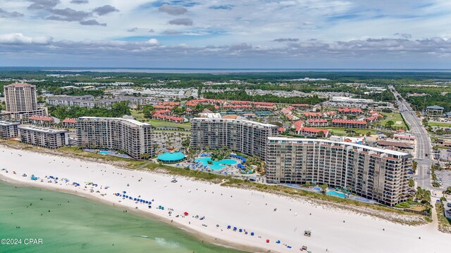 drone / aerial view with a water view and a view of the beach