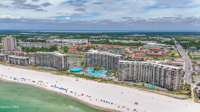 birds eye view of property with a water view, a view of city, and a view of the beach