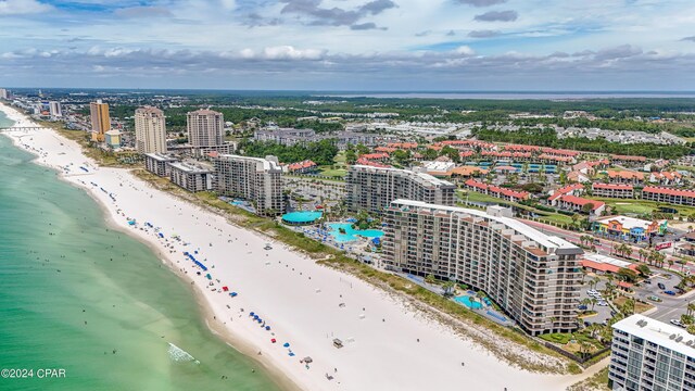 bird's eye view featuring a water view and a view of the beach