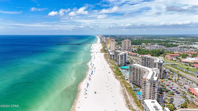 birds eye view of property with a view of the beach and a water view