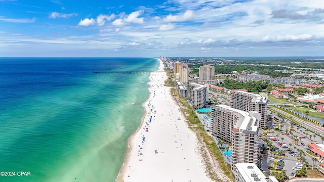 aerial view featuring a water view, a view of city, and a view of the beach