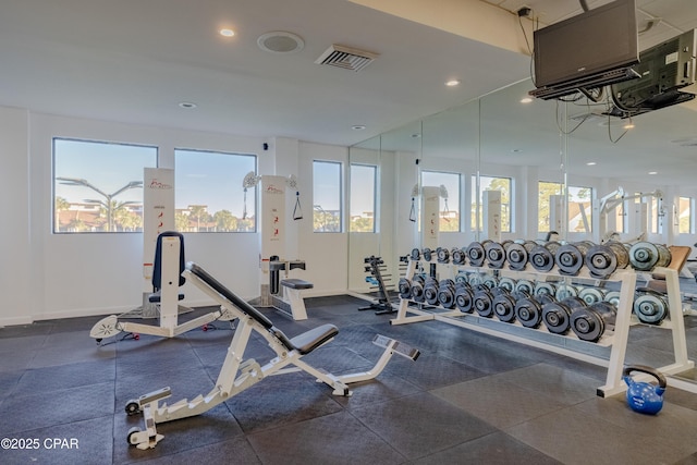 gym with baseboards, visible vents, and recessed lighting