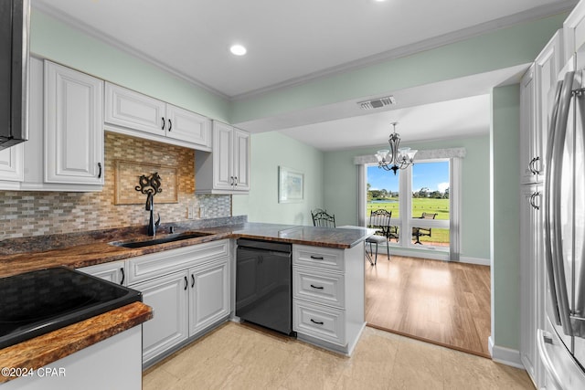 kitchen with an inviting chandelier, kitchen peninsula, white cabinetry, and dishwasher