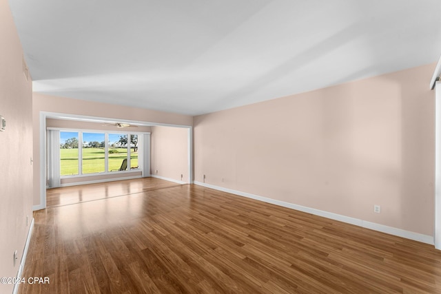 spare room with hardwood / wood-style floors