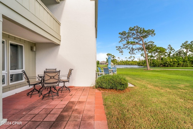 view of patio / terrace featuring a water view