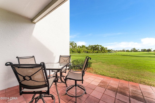 4305 Bay Point Rd Unit 467, Panama City, FL 32408 - view of patio / terrace featuring outdoor dining space and golf course view