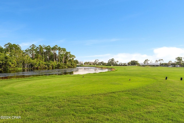 4305 Bay Point Rd Unit 467, Panama City, FL 32408 - view of grassy yard featuring a water view and view of golf course