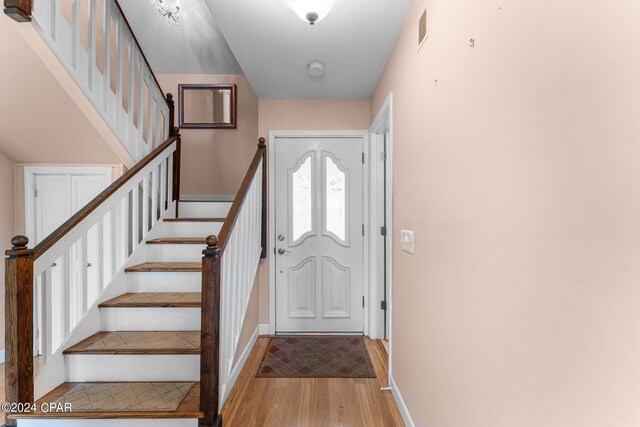4305 Bay Point Rd Unit 467, Panama City, FL 32408 - entrance foyer featuring light wood finished floors, baseboards, and stairs