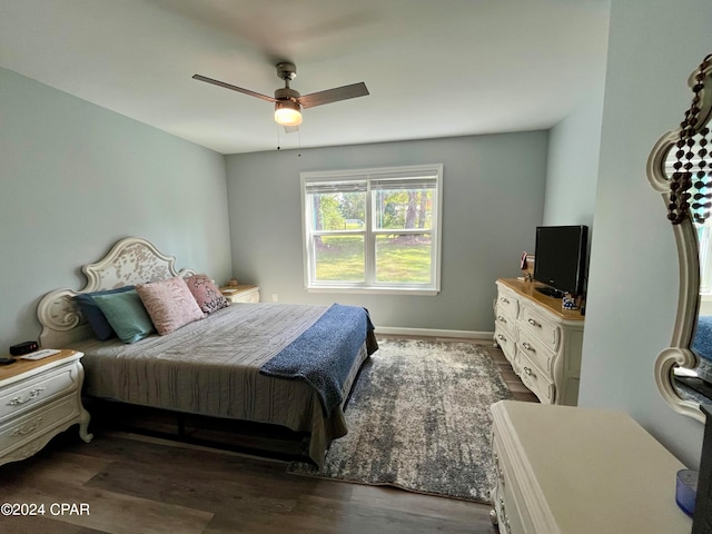 bedroom featuring ceiling fan and dark hardwood / wood-style flooring