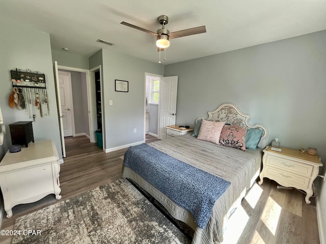 bedroom featuring dark hardwood / wood-style floors and ceiling fan